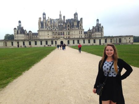 woman standing in front of old building in France